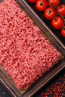 Raw ground beef for a burger or as an ingredient in a meat dish. Raw ground beef as a food background for your design