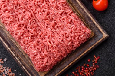 Raw ground beef for a burger or as an ingredient in a meat dish. Raw ground beef as a food background for your design