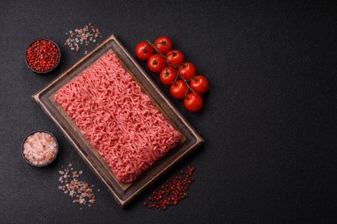 Raw ground beef for a burger or as an ingredient in a meat dish. Raw ground beef as a food background for your design