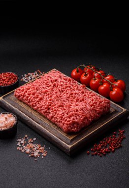 Raw ground beef for a burger or as an ingredient in a meat dish. Raw ground beef as a food background for your design