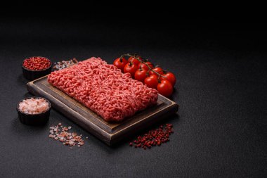 Raw ground beef for a burger or as an ingredient in a meat dish. Raw ground beef as a food background for your design