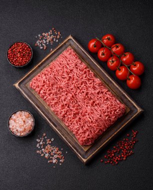 Raw ground beef for a burger or as an ingredient in a meat dish. Raw ground beef as a food background for your design