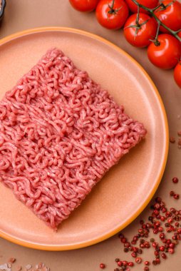 Raw ground beef for a burger or as an ingredient in a meat dish. Raw ground beef as a food background for your design