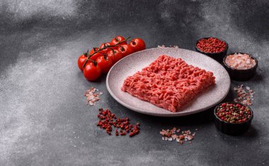Raw ground beef for a burger or as an ingredient in a meat dish. Raw ground beef as a food background for your design