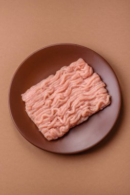 Raw minced chicken for a burger or as an ingredient in a meat dish. Raw ground chicken as a food background for your design