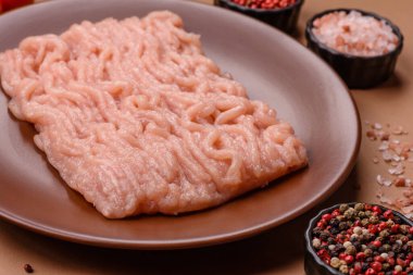 Raw minced chicken for a burger or as an ingredient in a meat dish. Raw ground chicken as a food background for your design
