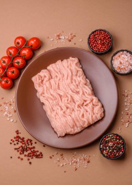 Raw minced chicken for a burger or as an ingredient in a meat dish. Raw ground chicken as a food background for your design