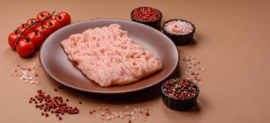 Raw minced chicken for a burger or as an ingredient in a meat dish. Raw ground chicken as a food background for your design