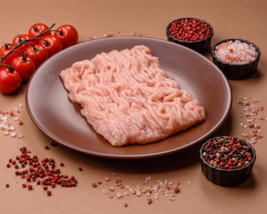 Raw minced chicken for a burger or as an ingredient in a meat dish. Raw ground chicken as a food background for your design