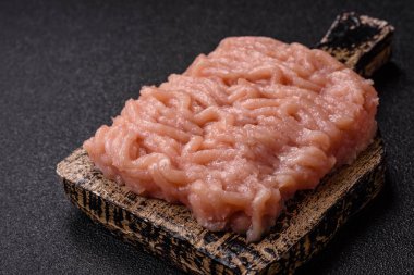 Raw minced chicken for a burger or as an ingredient in a meat dish. Raw ground chicken as a food background for your design