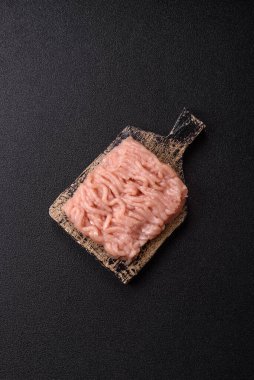 Raw minced chicken for a burger or as an ingredient in a meat dish. Raw ground chicken as a food background for your design