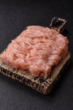 Raw minced chicken for a burger or as an ingredient in a meat dish. Raw ground chicken as a food background for your design