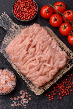 Raw minced chicken for a burger or as an ingredient in a meat dish. Raw ground chicken as a food background for your design