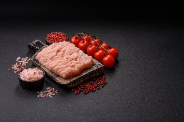 Raw minced chicken for a burger or as an ingredient in a meat dish. Raw ground chicken as a food background for your design