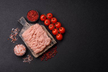 Raw minced chicken for a burger or as an ingredient in a meat dish. Raw ground chicken as a food background for your design