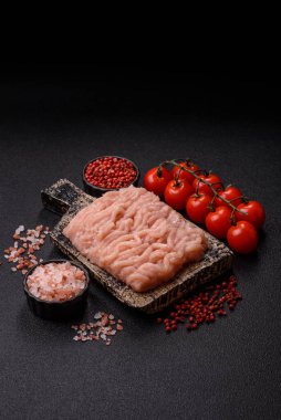 Raw minced chicken for a burger or as an ingredient in a meat dish. Raw ground chicken as a food background for your design