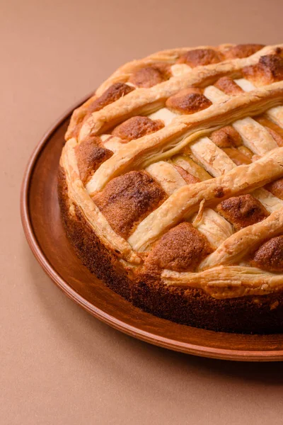 Sweet American pie with apples, pears, and cinnamon, a homemade dessert. Apple American pie as a food background for your design.