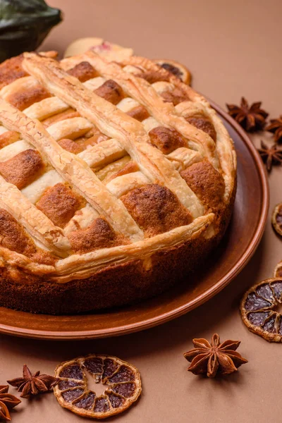 Sweet American pie with apples, pears, and cinnamon, a homemade dessert. Apple American pie as a food background for your design.