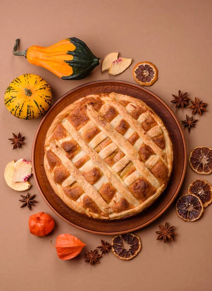 Sweet American pie with apples, pears, and cinnamon, a homemade dessert. Apple American pie as a food background for your design.