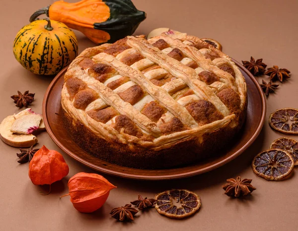 Sweet American pie with apples, pears, and cinnamon, a homemade dessert. Apple American pie as a food background for your design.