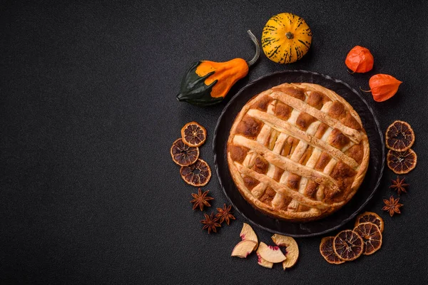 Sweet American pie with apples, pears, and cinnamon, a homemade dessert. Apple American pie as a food background for your design.