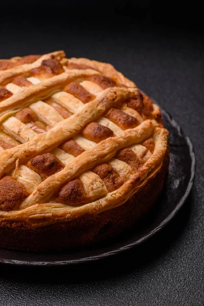 Sweet American pie with apples, pears, and cinnamon, a homemade dessert. Apple American pie as a food background for your design.