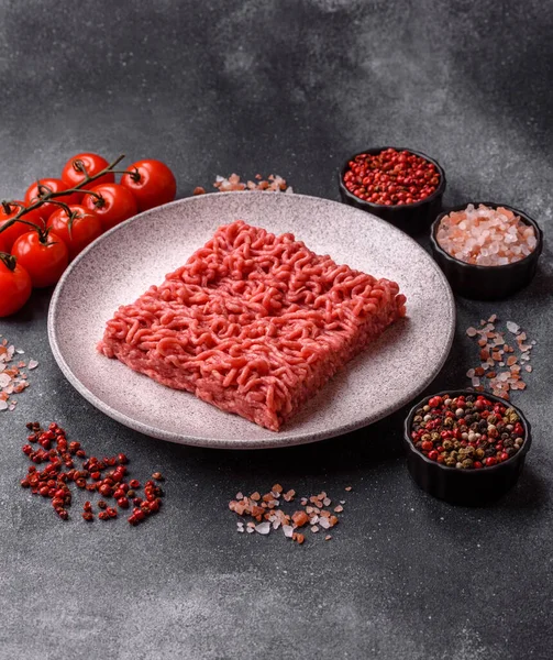 Raw ground beef for a burger or as an ingredient in a meat dish. Raw ground beef as a food background for your design