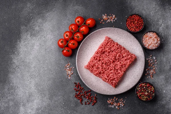 Raw ground beef for a burger or as an ingredient in a meat dish. Raw ground beef as a food background for your design