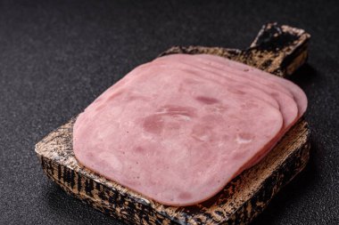 Meat, square ham sliced, organic food, protein for snacks. Sliced ham as a food background for your design