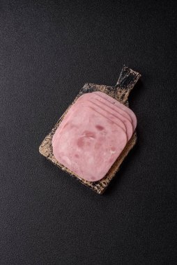 Meat, square ham sliced, organic food, protein for snacks. Sliced ham as a food background for your design
