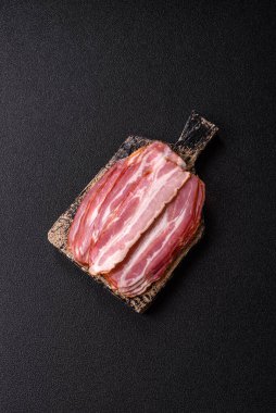 Meat, raw pork bacon sliced, organic food, protein for snacks. Raw bacon as a food background for your design