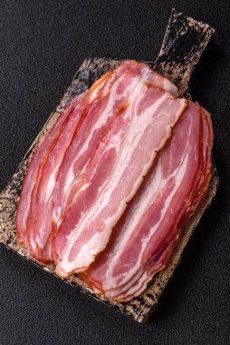 Meat, raw pork bacon sliced, organic food, protein for snacks. Raw bacon as a food background for your design