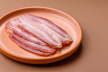 Meat, raw pork bacon sliced, organic food, protein for snacks. Raw bacon as a food background for your design