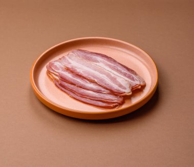 Meat, raw pork bacon sliced, organic food, protein for snacks. Raw bacon as a food background for your design