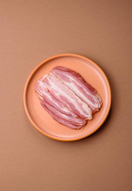 Meat, raw pork bacon sliced, organic food, protein for snacks. Raw bacon as a food background for your design