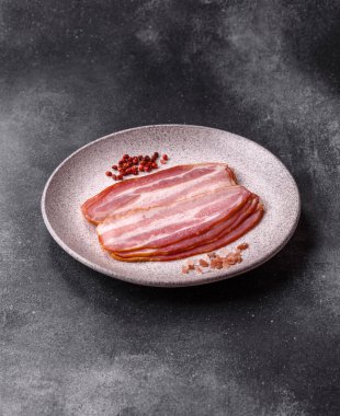 Meat, raw pork bacon sliced, organic food, protein for snacks. Raw bacon as a food background for your design