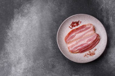 Meat, raw pork bacon sliced, organic food, protein for snacks. Raw bacon as a food background for your design