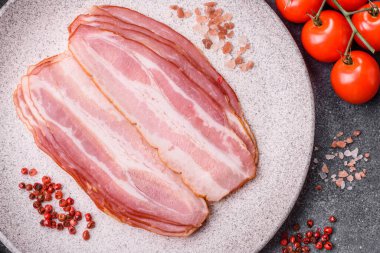 Meat, raw pork bacon sliced, organic food, protein for snacks. Raw bacon as a food background for your design
