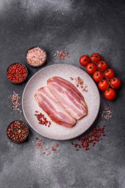 Meat, raw pork bacon sliced, organic food, protein for snacks. Raw bacon as a food background for your design