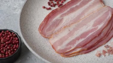 Meat, raw pork bacon sliced, organic food, protein for snacks. Raw bacon as a food background for your design