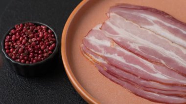 Meat, raw pork bacon sliced, organic food, protein for snacks. Raw bacon as a food background for your design