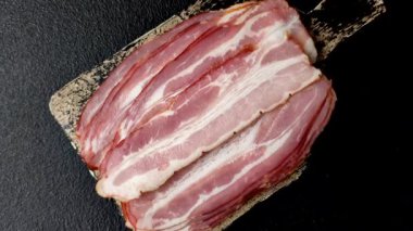 Meat, raw pork bacon sliced, organic food, protein for snacks. Raw bacon as a food background for your design