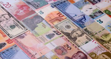 Paper money, banknotes of different countries in several denominations as a business background. Paper money and cash as a financial background for your design.