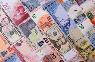 Paper money, banknotes of different countries in several denominations as a business background. Paper money and cash as a financial background for your design.