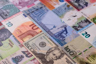 Paper money, banknotes of different countries in several denominations as a business background. Paper money and cash as a financial background for your design.