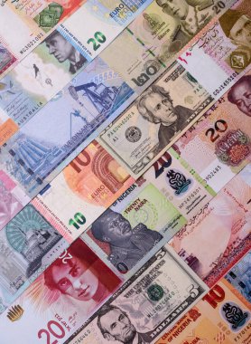 Paper money, banknotes of different countries in several denominations as a business background. Paper money and cash as a financial background for your design.