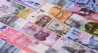 Paper money, banknotes of different countries in several denominations as a business background. Paper money and cash as a financial background for your design.