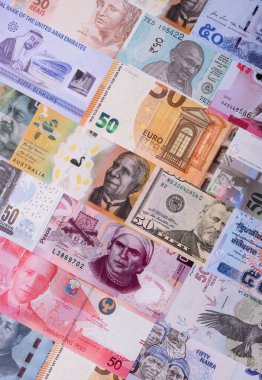 Paper money, banknotes of different countries in several denominations as a business background. Paper money and cash as a financial background for your design.