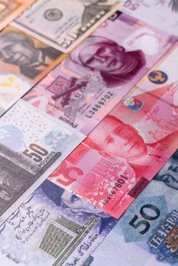 Paper money, banknotes of different countries in several denominations as a business background. Paper money and cash as a financial background for your design.