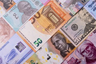 Paper money, banknotes of different countries in several denominations as a business background. Paper money and cash as a financial background for your design.